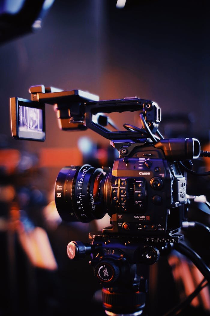 trusted-partner Close-up of a professional video camera setup indoors, capturing high-quality footage.