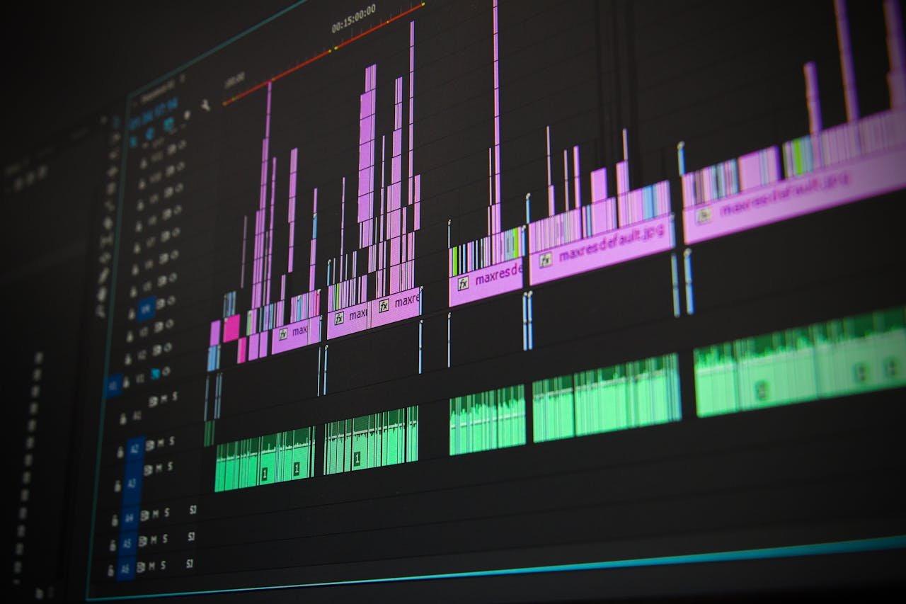 home-img Close-up of a professional audio and video editing software interface with waveform displays.